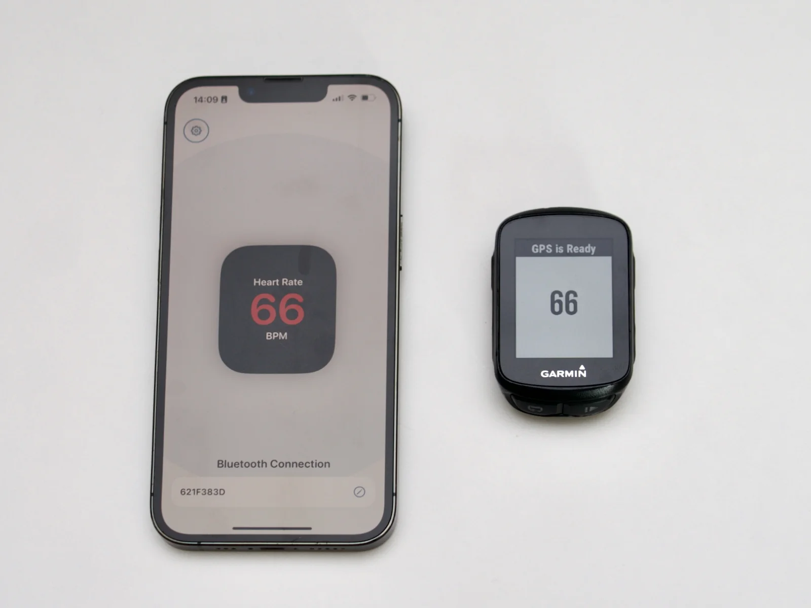 iPhone and Garmin Edge 130 both showing live heart rate — successfully paired